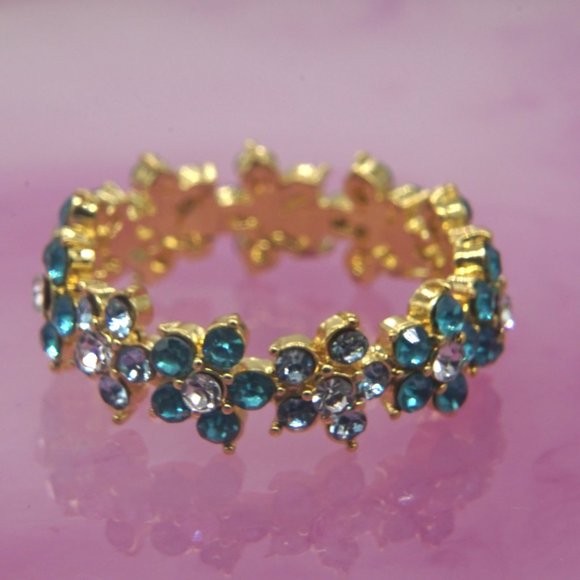 Ring of daisies with blue stones and center CZ. - Picture 3 of 3